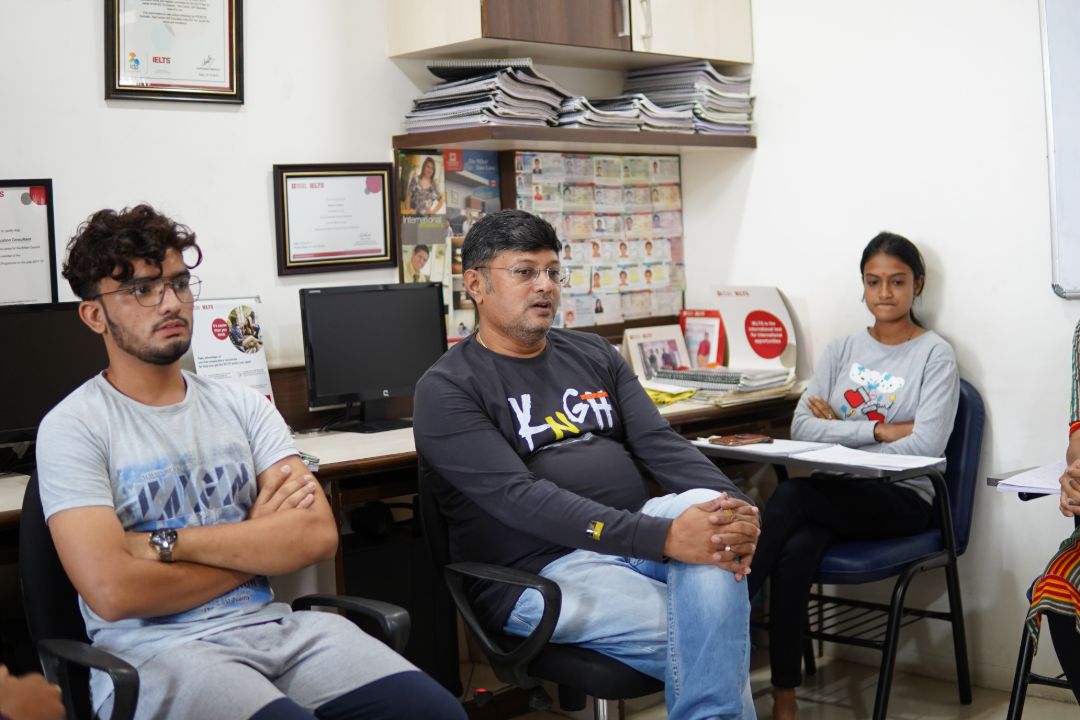 Nikunj Pandya counseling students in office